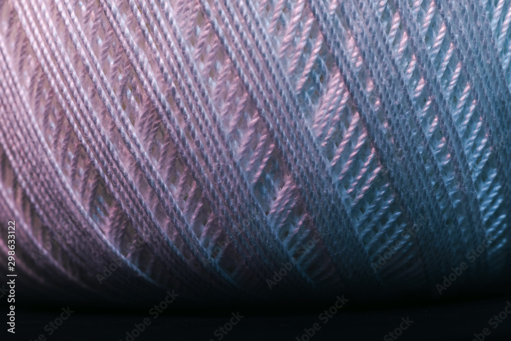Poster close up beautiful white thread in red and blue light background texture. macro photography view.