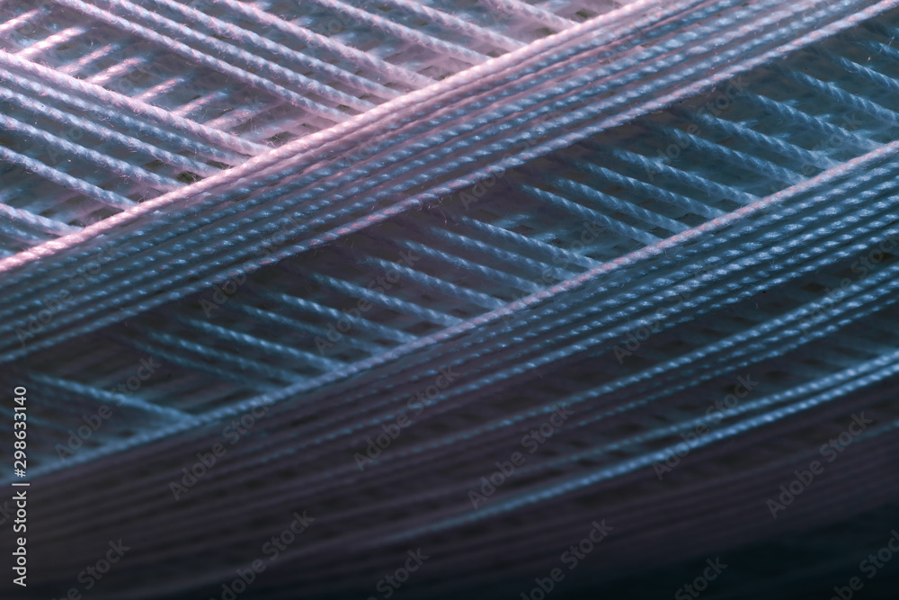 Poster close up beautiful white thread in red and blue light background texture. macro photography view.