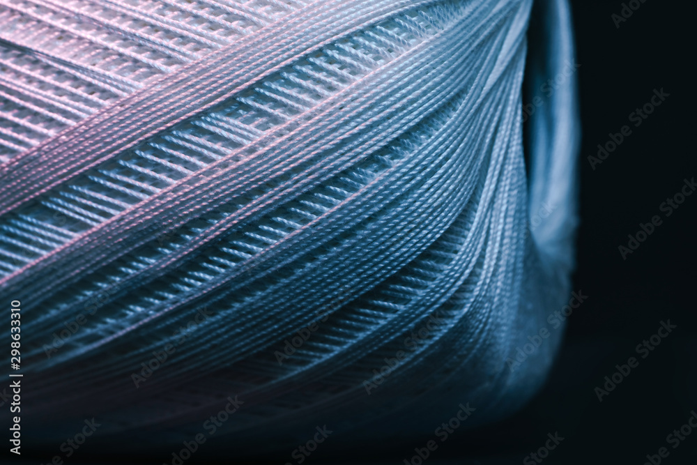 Poster close up beautiful tangle of thread in red and blue light background texture. macro photography view