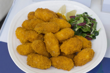 Fresh fried oysters with salad