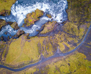 View from flying drone. Splendid morning view of nameless waterfall. Fresh green hills on the southern coast of Iceland . Beauty of nature concept background..