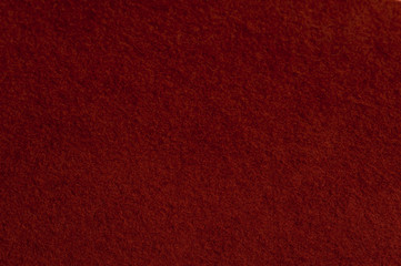 Close-up burgundy woolen cloth from a hat