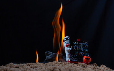 Label welcome Halloween party on fire background,