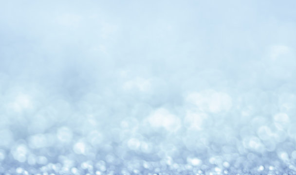 Abstract winter Christmas light blue background with bokeh