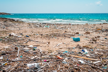 Plastic objects such as bottles, wrappers and balloons on a beach in the Mediterranean Sea, at the Aegean sea of ​​Greece, are already visible environmental pollution. There was no Beach Clean Up here