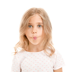 Grimacing little girl on white background