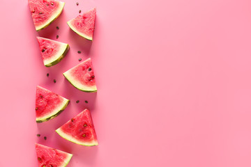 Slices of sweet ripe watermelon on color background - obrazy, fototapety, plakaty