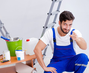 Repairman doing renovation repair in the house with paper wallpa