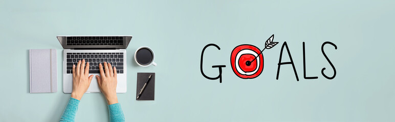 Goal concept with person using a laptop computer