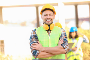 Portrait of male architect in building area