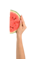 Female hand with slice of ripe watermelon on white background