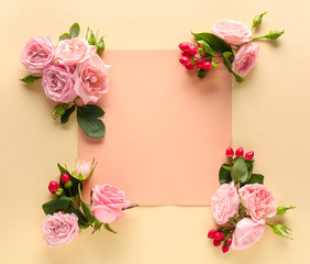 Blank card and beautiful roses on color background