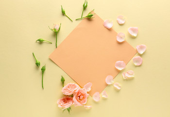 Blank card and beautiful roses on color background