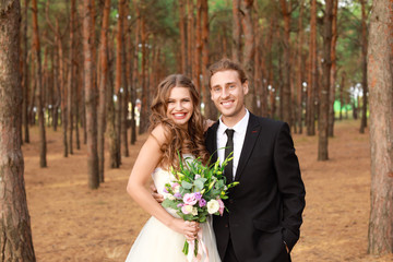 Happy couple celebrating their wedding outdoors