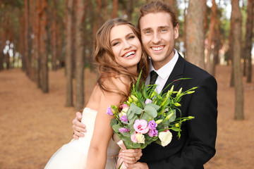 Happy couple celebrating their wedding outdoors