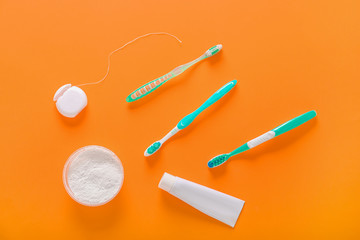 Set for dental hygiene on color background