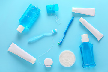 Set for dental hygiene on color background