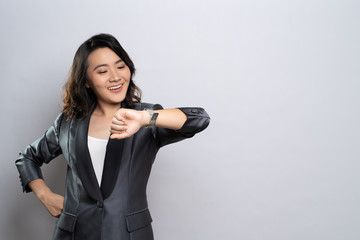 Happy woman holding hand with wrist watch