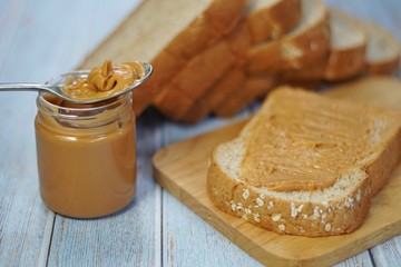 bread with peanut butter and honey on a white plate