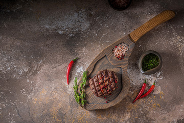 Top view of fillet mignon beef steak on board