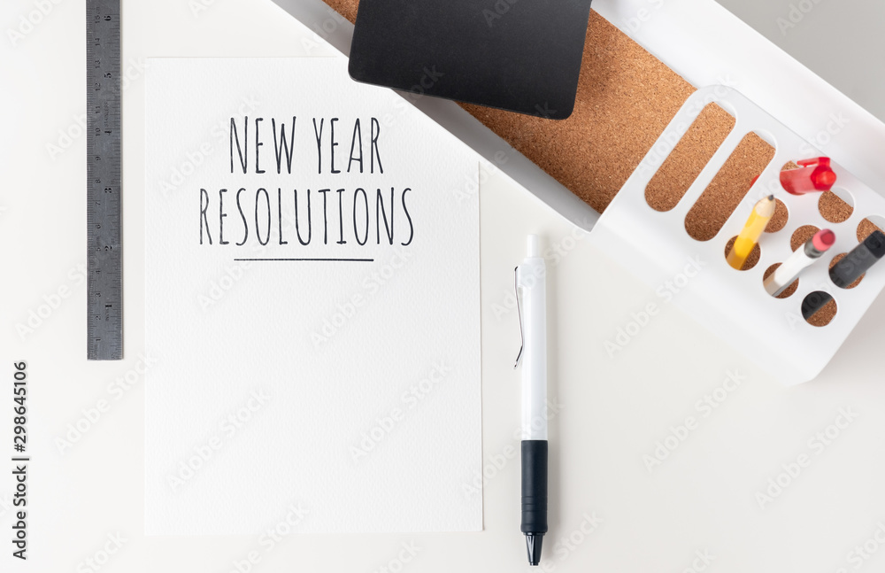Poster top view new year resolutions 2020 paper note on modern office stationery on white table.pencil, not