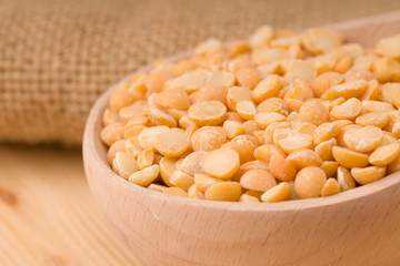 Dry dry peas in the wooden spoon, healty food.