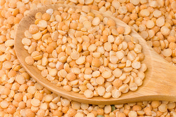 Dry dry peas in the wooden spoon, healty food.