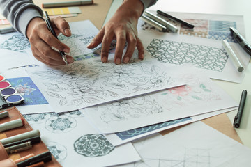 Designer designing drawing sketch pattern geometric flower seamless wallpaper fabric textile...