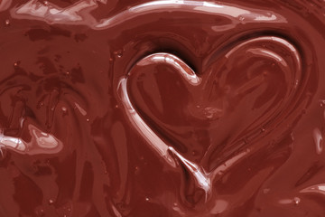 Chocolate heart background.. The texture of liquid dark chocolate.