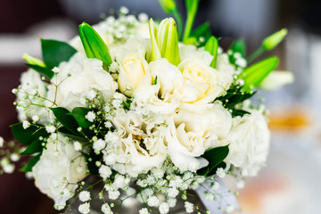Obraz na płótnie Canvas Closeup photo of wedding white rose bouqet