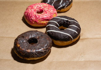 Tasty delicious doughnuts on eco paper background