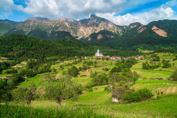 Fototapeta na wymiar Stunning summer alpine landscape with Dreznica village, Slovenia, Europe