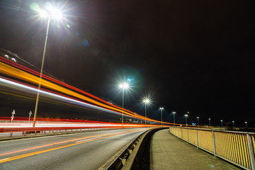 Fototapeta na wymiar Long exposure photo of traffic on the move at dusk on the motorway