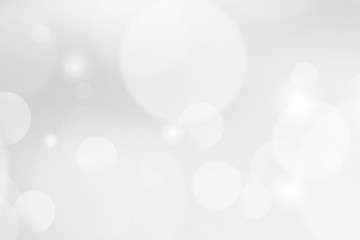 abstract blur white bokeh circles on gray background.