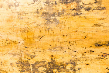 top view of worn yellow wooden background.