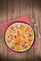 Tart with fried potato, raclette cheese and smoke flavour bacon.
