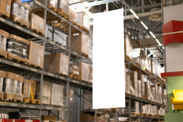 Blank mock-up advertising with copy space in the warehouse (storage) with rows of shelves with goods boxes