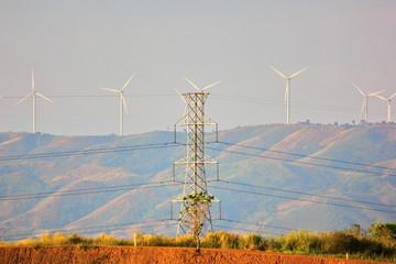 Fototapeta na wymiar eletricity pole get eletric current from wind turbine transfer to home,town ,city