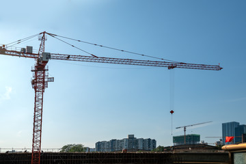 Fototapeta na wymiar Tower cranes, skyscrapers on construction sites