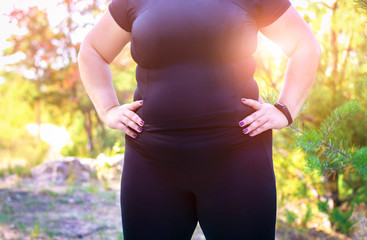 Fat girl wants to lose weight. An obese woman does sports. The girl with excess weight.
