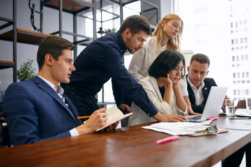 young office workers having some problems, trying to overcome them, solve them, difficulties in business, failure