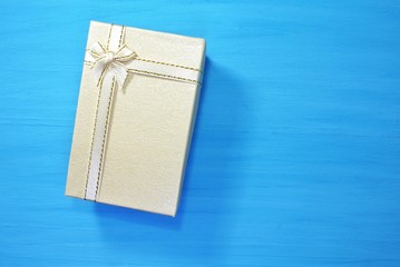 Gift boxes on a blue wooden background and copy space.