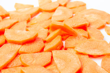 Slices of fresh ripe carrots on a white background isolate