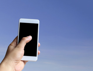 Hand of a man holding smartphone device.