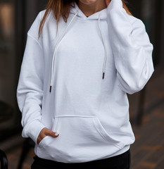 young girl wears white hoodie	