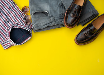 Men fashion clothing set isolated on a yellow background. Office clothes concept, Top view