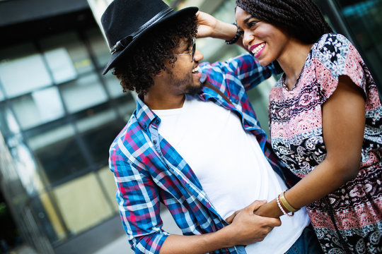 Couple happiness fun concept. Black young people embracing laughing on date.
