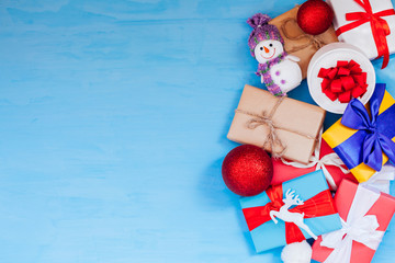 lots of christmas presents for Christmas and new year on a blue background