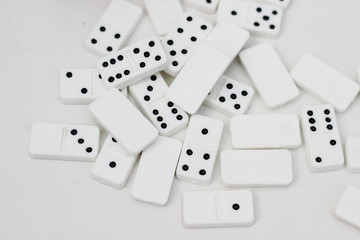 Traditional miniature dominos as a wedding gift.Pieces of dominos on a white background