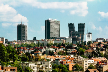 Fototapeta premium View of the old building on the background of high-rise buildings in Prague.
